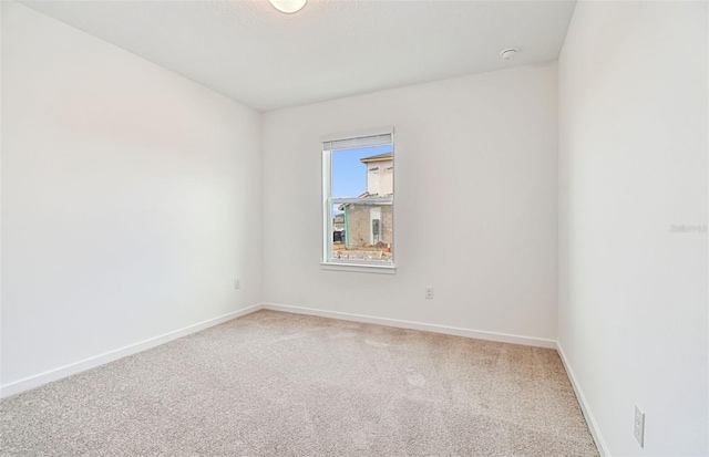 10426 Cross River Trl, Parrish, FL 34219 - spare room with light colored carpet and a smoke detector