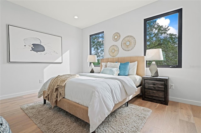 532 W Plaza Pl Unit 3, Tampa, FL 33602 - bedroom with wood finished floors, multiple windows, and recessed lighting