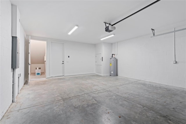 532 W Plaza Pl Unit 3, Tampa, FL 33602 - garage featuring water heater, a garage door opener, and concrete block wall