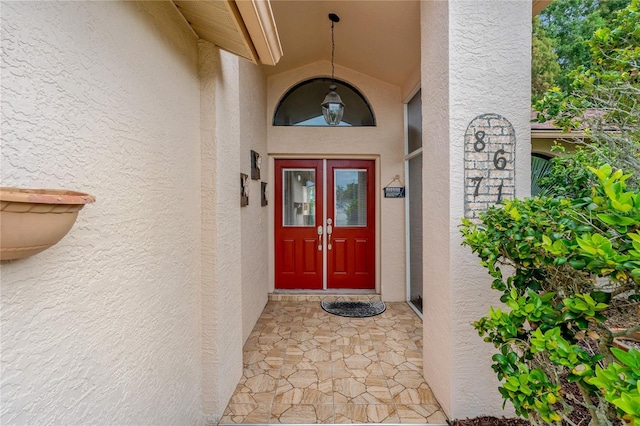8671 Cypress Lakes Blvd, New Port Richey, FL 34653 - entrance to property featuring stucco siding and french doors
