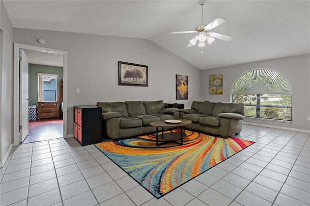 8671 Cypress Lakes Blvd, New Port Richey, FL 34653 - living area featuring light tile patterned floors, lofted ceiling, and ceiling fan