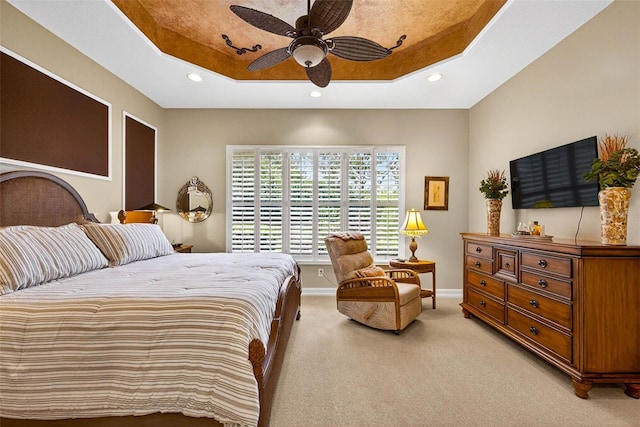 15744 Crystal Waters Dr, Wimauma, FL 33598 - bedroom with a raised ceiling, light carpet, recessed lighting, and a ceiling fan