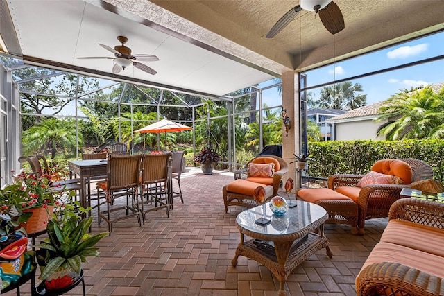 15744 Crystal Waters Dr, Wimauma, FL 33598 - sunroom with a ceiling fan, outdoor dining space, an outdoor hangout area, and beamed ceiling