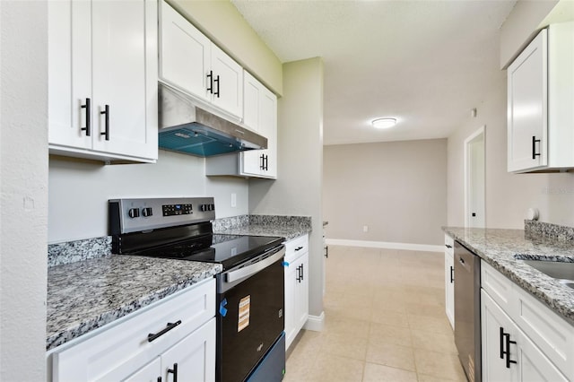 2902 Wheeler St, Bartow, FL 33830 - kitchen with stainless steel appliances, under cabinet range hood, white cabinetry, light stone countertops, and light tile patterned floors