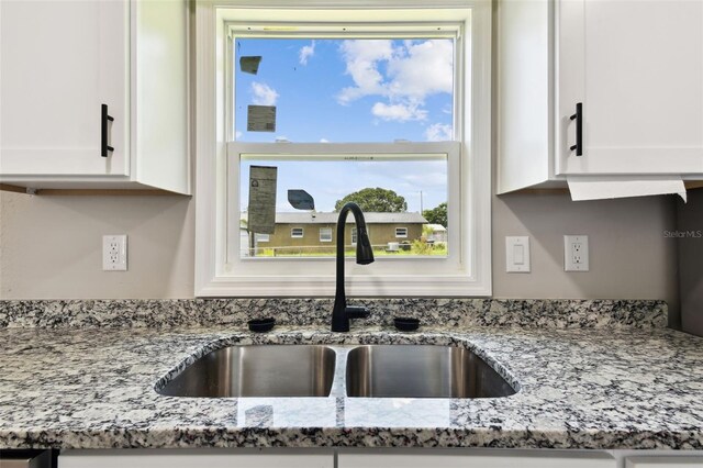 2902 Wheeler St, Bartow, FL 33830 - kitchen view of white cabinets and light stone counters