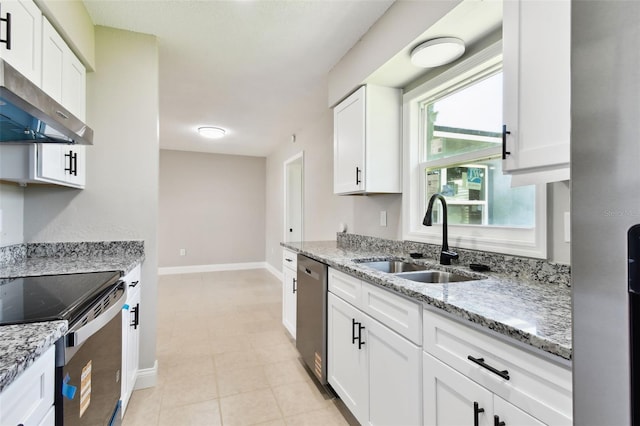 2902 Wheeler St, Bartow, FL 33830 - kitchen with range hood, stainless steel appliances, white cabinets, light stone counters, and light tile patterned floors