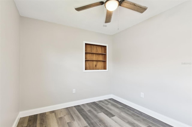 2902 Wheeler St, Bartow, FL 33830 - unfurnished room featuring ceiling fan, wood finished floors, and built in shelves