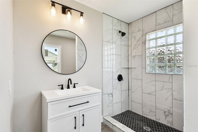 2902 Wheeler St, Bartow, FL 33830 - bathroom featuring a tile shower, vanity, and plenty of natural light