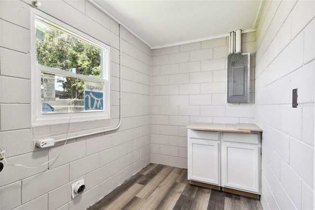 2902 Wheeler St, Bartow, FL 33830 - bathroom with wood finished floors, electric panel, and crown molding
