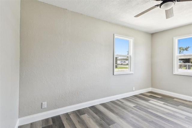 2902 Wheeler St, Bartow, FL 33830 - spare room featuring plenty of natural light, wood finished floors, and a ceiling fan