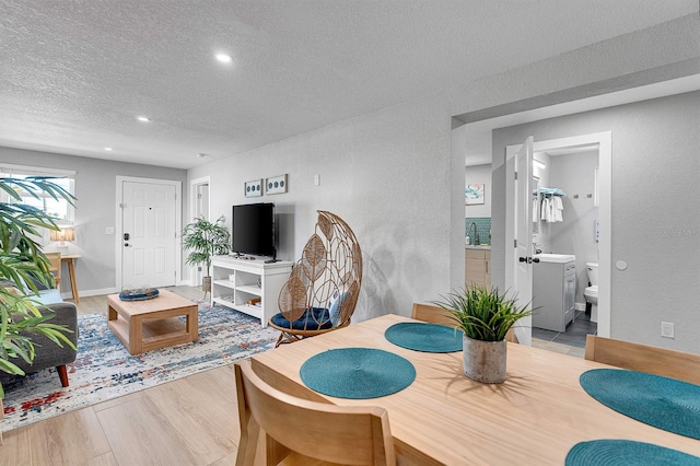 122 Coral Ave, Redington Shores, FL 33708 - dining space with a textured ceiling, wood finished floors, recessed lighting, and a textured wall