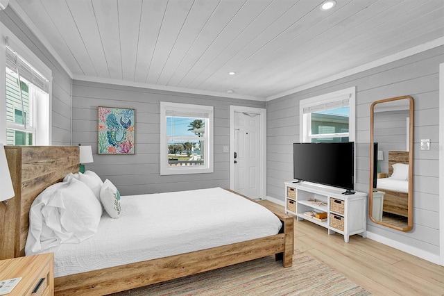 122 Coral Ave, Redington Shores, FL 33708 - bedroom with wooden ceiling, wood finished floors, wood walls, recessed lighting, and crown molding