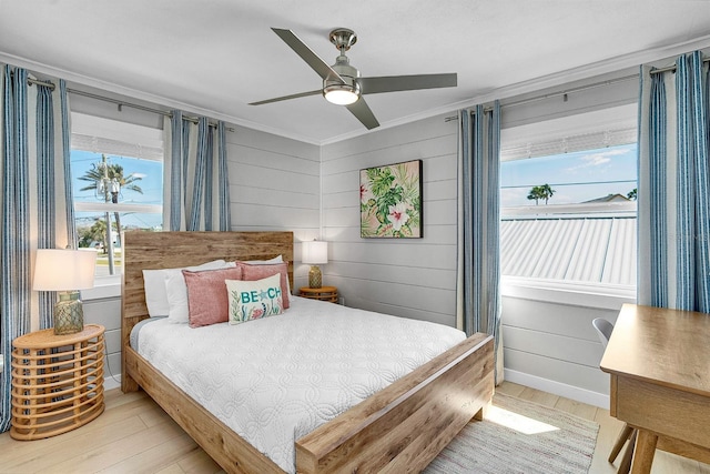 122 Coral Ave, Redington Shores, FL 33708 - bedroom with light wood-style flooring, ornamental molding, and ceiling fan