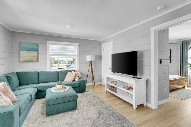 122 Coral Ave, Redington Shores, FL 33708 - living room featuring crown molding, light wood-type flooring, healthy amount of natural light, wood walls, and recessed lighting