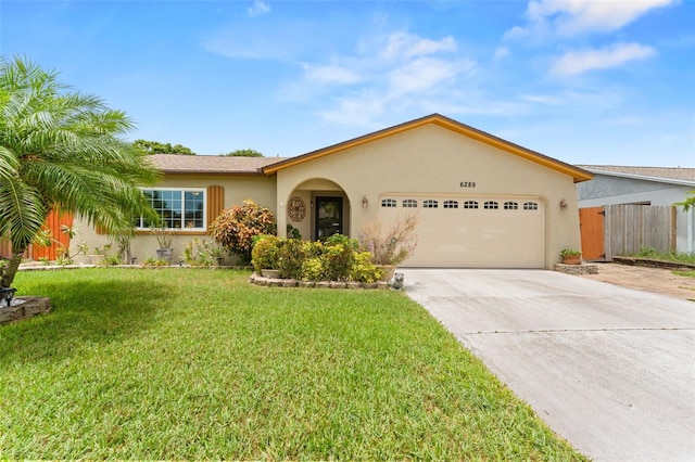 6289 107th Ave N, Pinellas Park, FL 33782 - single story home with stucco siding, a garage, and concrete driveway