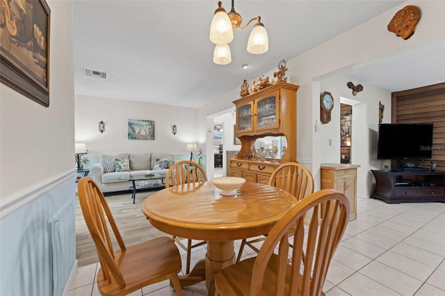 6289 107th Ave N, Pinellas Park, FL 33782 - dining area with light tile patterned floors and a chandelier