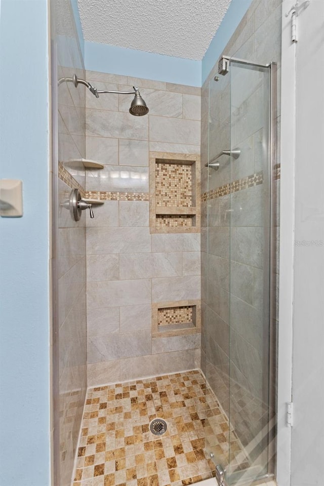 6289 107th Ave N, Pinellas Park, FL 33782 - bathroom with a stall shower and a textured ceiling