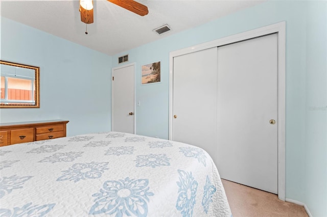 6289 107th Ave N, Pinellas Park, FL 33782 - bedroom featuring light carpet, a closet, and a ceiling fan