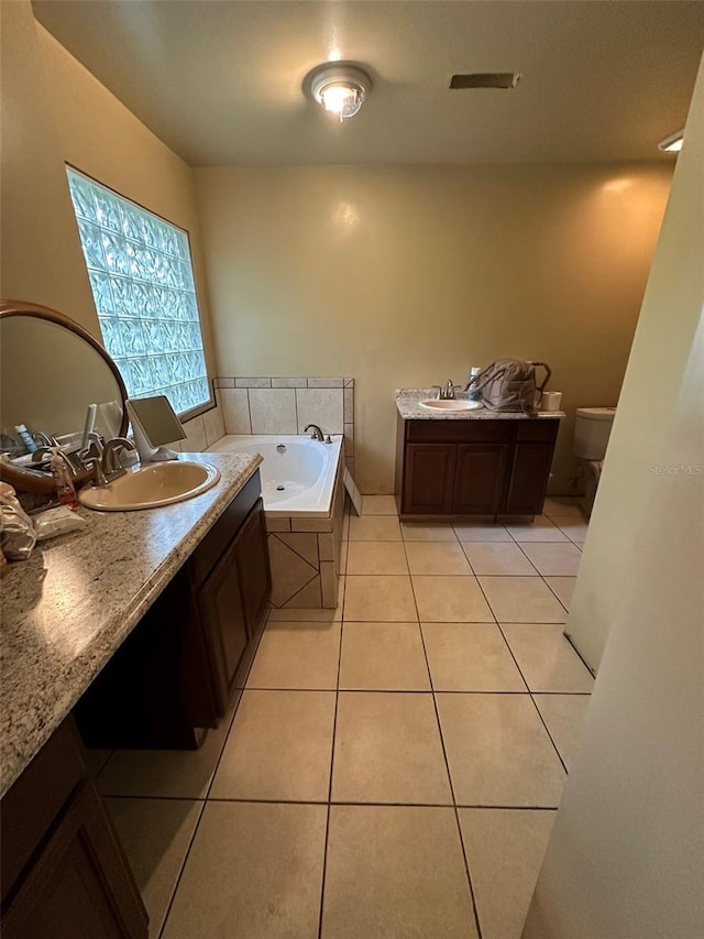120 Henry St, Interlachen, FL 32148 - bathroom featuring a tub with jets, tile patterned floors, and vanity