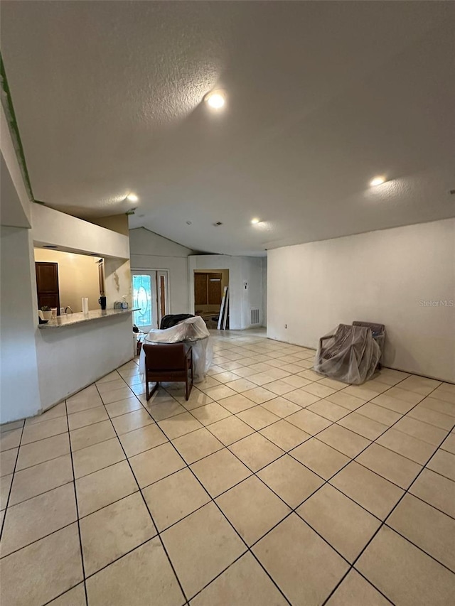 120 Henry St, Interlachen, FL 32148 - rec room with lofted ceiling, light tile patterned floors, and a textured ceiling