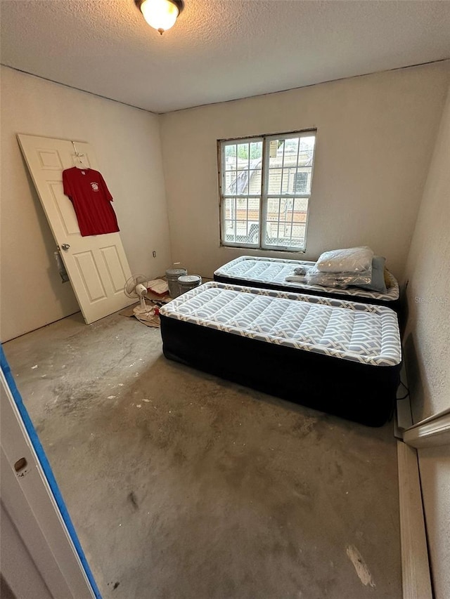 120 Henry St, Interlachen, FL 32148 - bedroom with concrete floors and a textured ceiling
