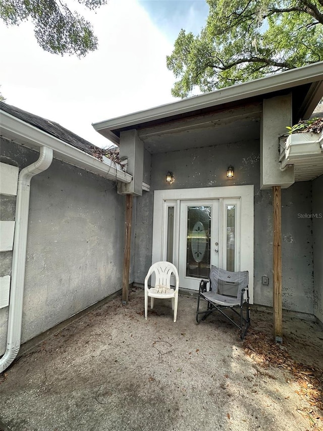 120 Henry St, Interlachen, FL 32148 - doorway to property with stucco siding