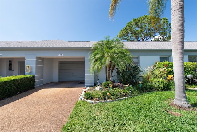 8451 Candlewood Rd Unit 8451, Seminole, FL 33777 - ranch-style home featuring driveway and stucco siding