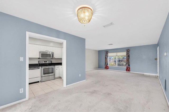 8451 Candlewood Rd Unit 8451, Seminole, FL 33777 - unfurnished living room featuring light carpet, a chandelier, and light tile patterned floors