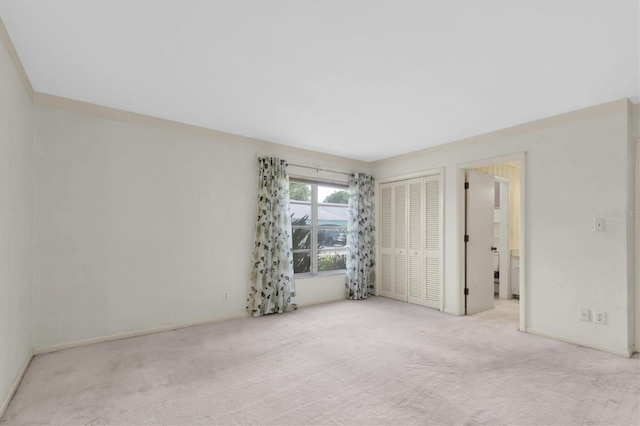 8451 Candlewood Rd Unit 8451, Seminole, FL 33777 - unfurnished bedroom featuring carpet and a closet