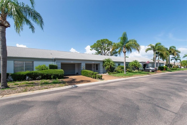 8451 Candlewood Rd Unit 8451, Seminole, FL 33777 - view of front of house featuring a garage and driveway