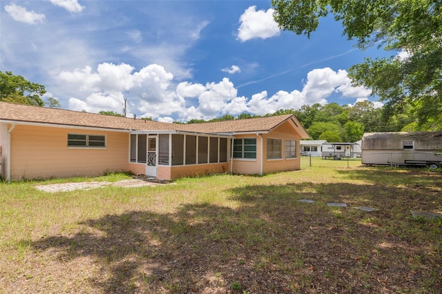 21078 SW Honeysuckle St, Dunnellon, FL 34431 - rear view of property featuring a sunroom