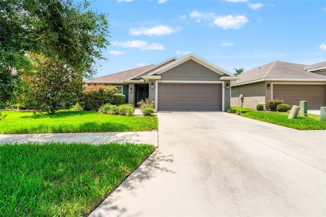 10909 Kirkwall Port Dr, Wimauma, FL 33598 - ranch-style home with an attached garage, a front yard, driveway, and stucco siding