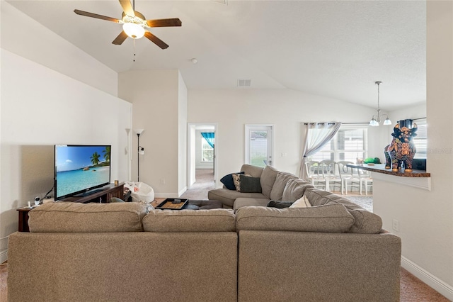10909 Kirkwall Port Dr, Wimauma, FL 33598 - carpeted living area featuring lofted ceiling, a ceiling fan, and healthy amount of natural light