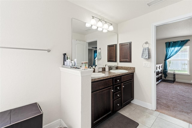 10909 Kirkwall Port Dr, Wimauma, FL 33598 - bathroom with double vanity and tile patterned flooring