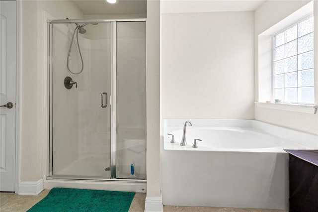 10909 Kirkwall Port Dr, Wimauma, FL 33598 - bathroom with a stall shower and a garden tub