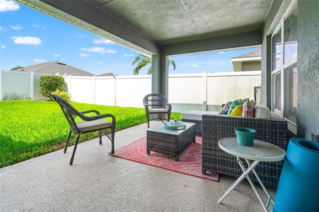 10909 Kirkwall Port Dr, Wimauma, FL 33598 - fenced backyard with a patio and an outdoor hangout area