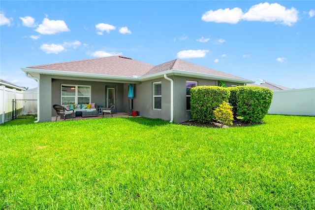 10909 Kirkwall Port Dr, Wimauma, FL 33598 - rear view of property with an outdoor hangout area, stucco siding, a fenced backyard, and roof with shingles