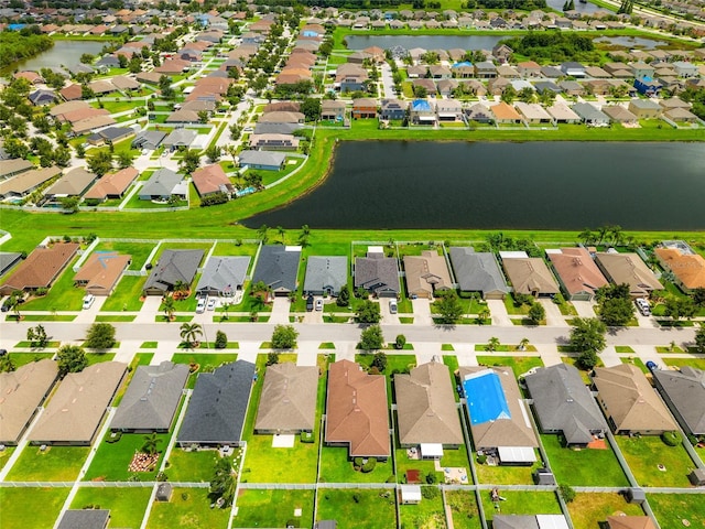 10909 Kirkwall Port Dr, Wimauma, FL 33598 - aerial view of residential area with a large body of water