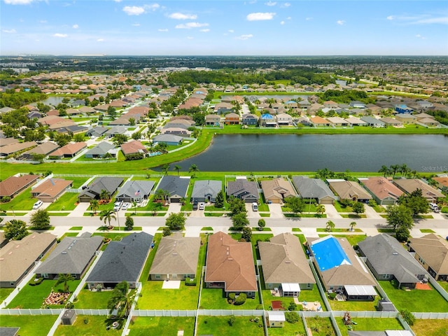 10909 Kirkwall Port Dr, Wimauma, FL 33598 - aerial perspective of suburban area with a nearby body of water