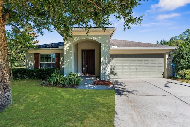 1280 Hill Flower Dr, Brooksville, FL 34604 - view of front of home featuring an attached garage, concrete driveway, a front lawn, and stucco siding