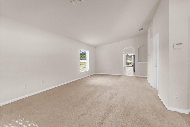 1280 Hill Flower Dr, Brooksville, FL 34604 - unfurnished room featuring arched walkways and light colored carpet