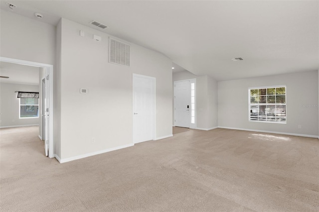 1280 Hill Flower Dr, Brooksville, FL 34604 - unfurnished living room with light colored carpet