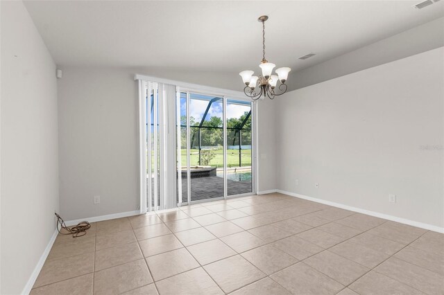 1280 Hill Flower Dr, Brooksville, FL 34604 - spare room with light tile patterned floors and a chandelier