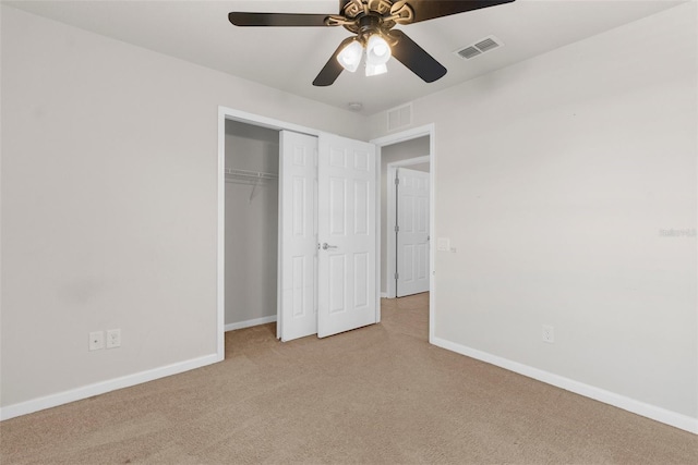 1280 Hill Flower Dr, Brooksville, FL 34604 - unfurnished bedroom featuring light carpet, a closet, and ceiling fan