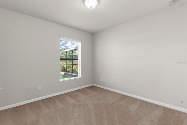 1280 Hill Flower Dr, Brooksville, FL 34604 - empty room with light carpet and a smoke detector