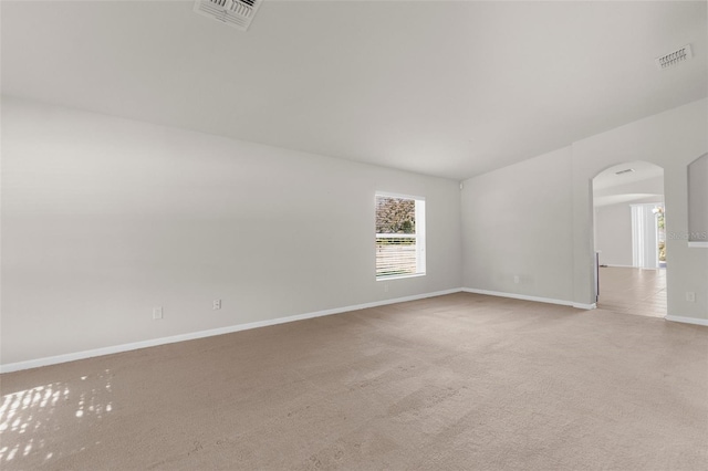 1280 Hill Flower Dr, Brooksville, FL 34604 - empty room featuring arched walkways and carpet flooring