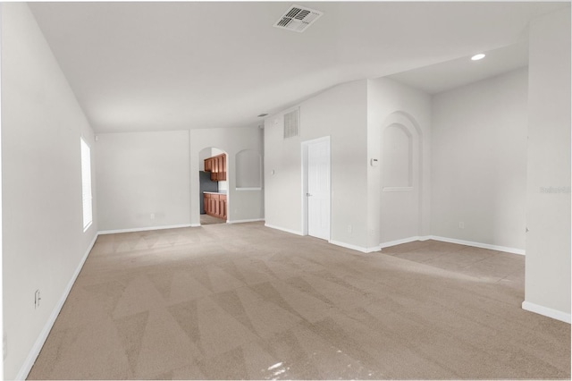 1280 Hill Flower Dr, Brooksville, FL 34604 - carpeted spare room with arched walkways, vaulted ceiling, and recessed lighting