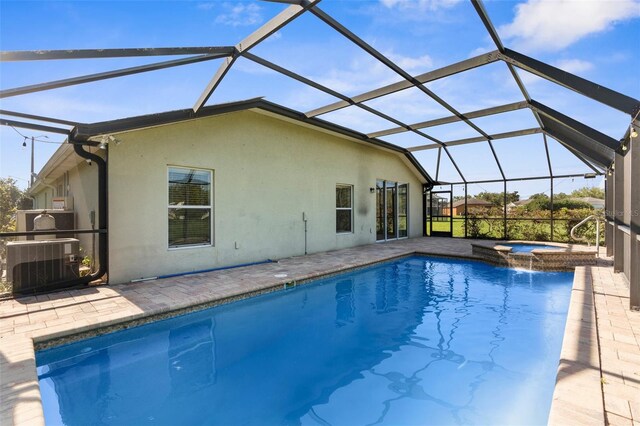 1280 Hill Flower Dr, Brooksville, FL 34604 - view of pool with a pool with connected hot tub, a patio, and glass enclosure