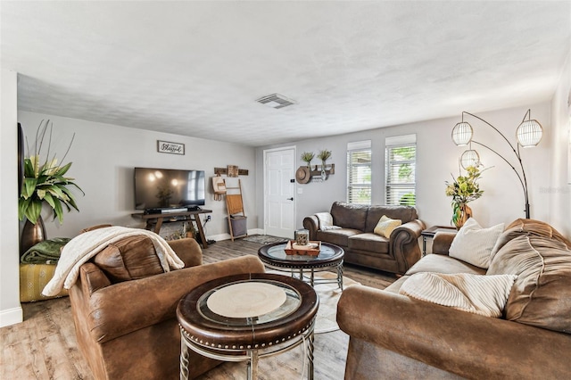 5744 Thrush Dr, New Port Richey, FL 34652 - living room featuring wood finished floors