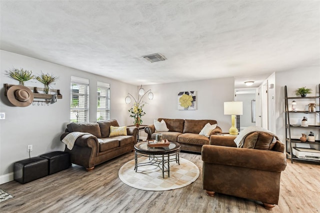 5744 Thrush Dr, New Port Richey, FL 34652 - living room featuring wood finished floors and baseboards